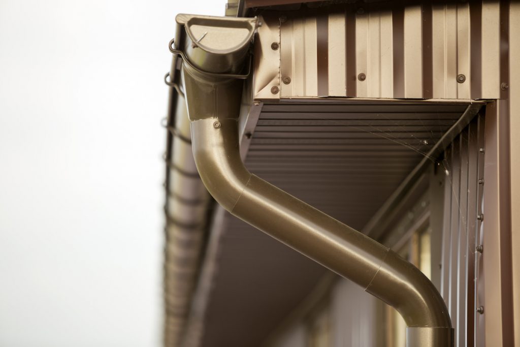 close up photo of gutter system of a cottage house
