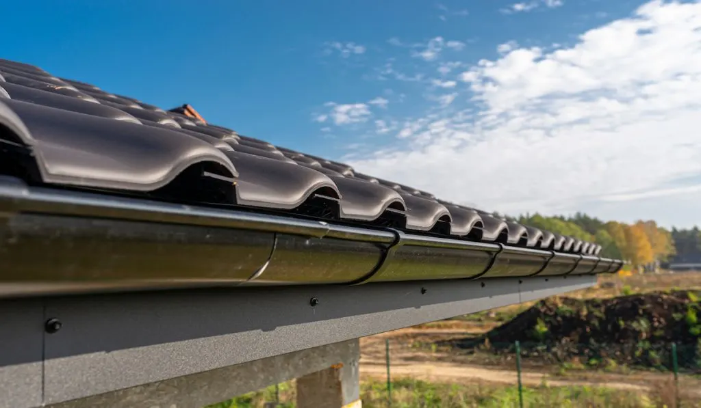 metal black gutter on a roof