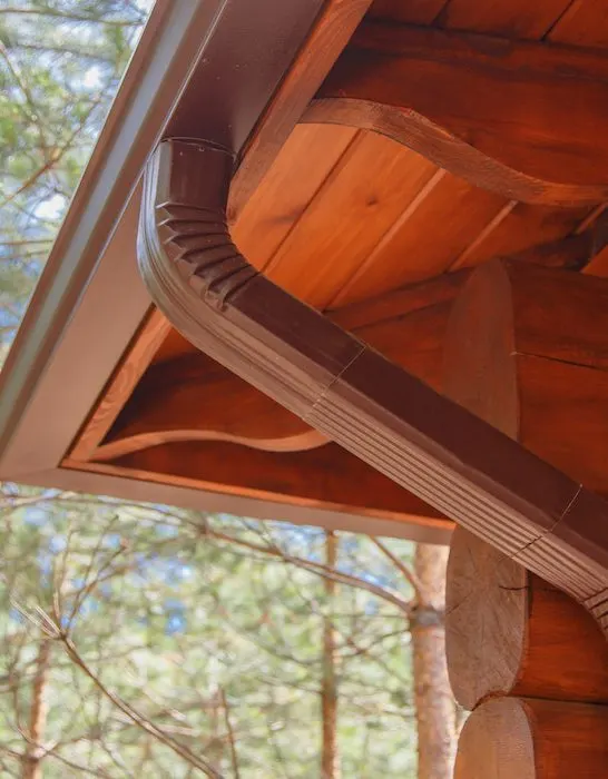 roof gutter and downspouts in a house at the forest