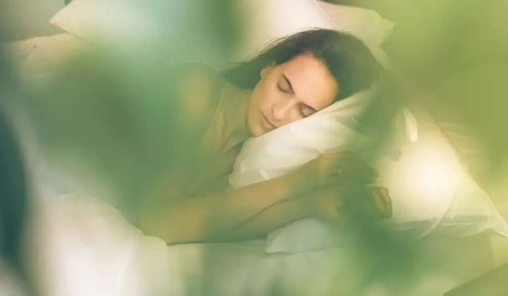 Woman sleeping on bed
