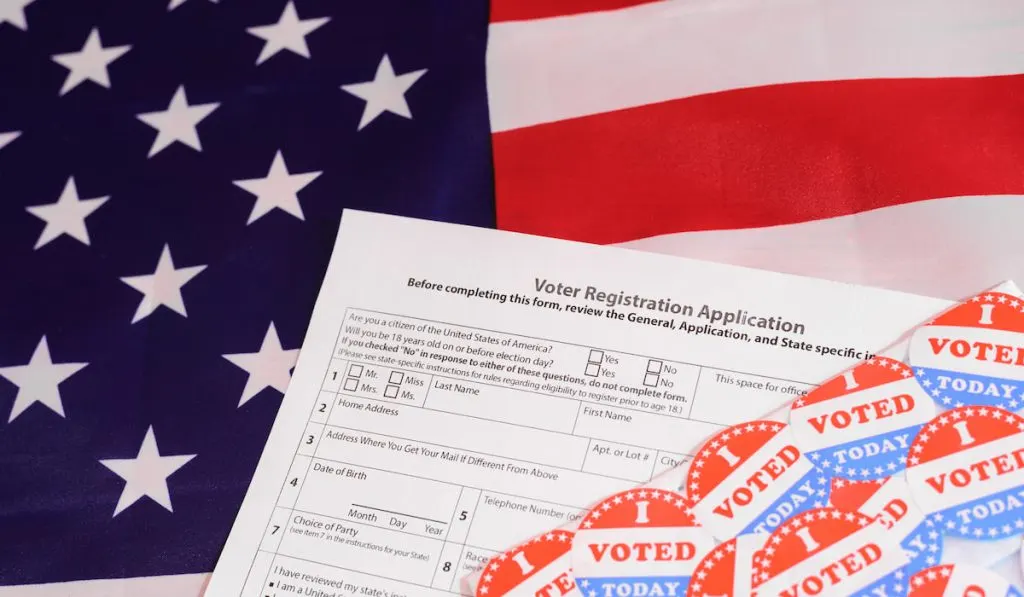 Voter registration application form on an American flag