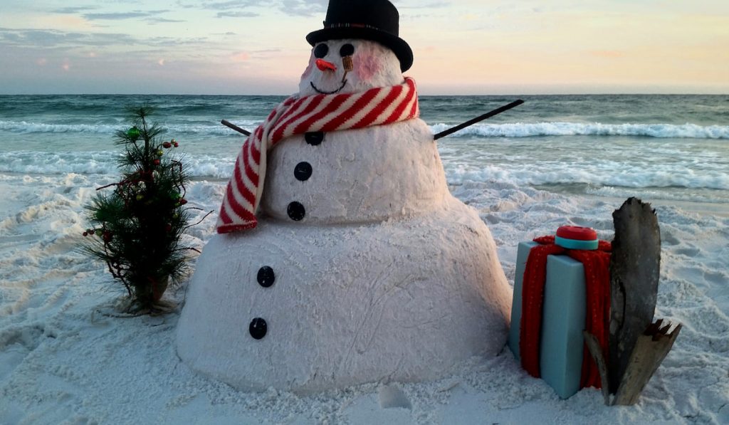 sandman is disguised as a snowman on Florida beach