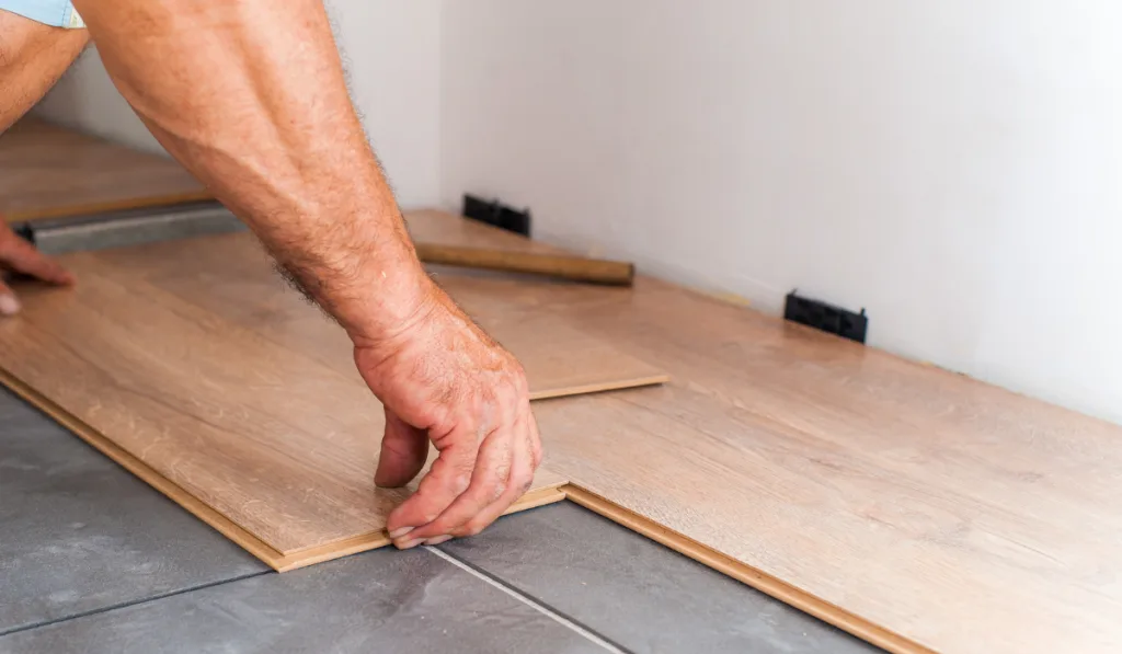 man setting the vinyl plank