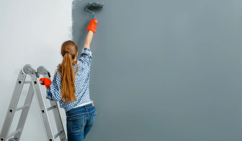 house painter paints walls