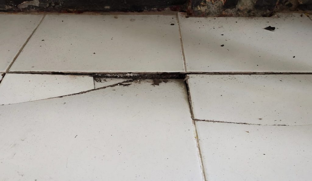 floor broken due to uneven foundation