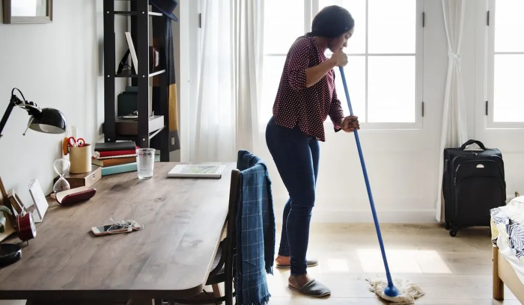 woman cleaning room