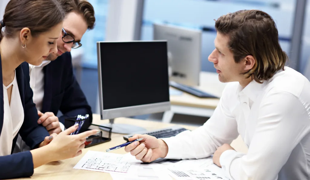 Adult couple in the office with real estate agent
