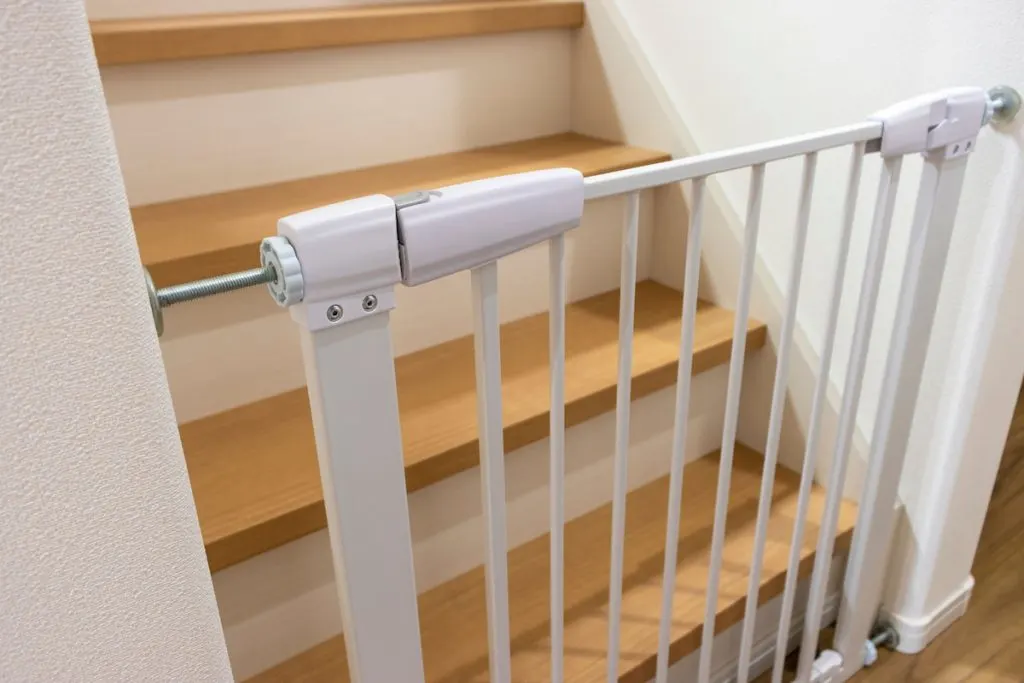 Baby gate installed on the stairs
