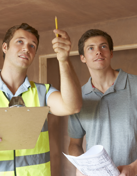 Builder-And-Inspector-Looking-At-New-Property