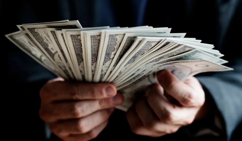 Closeup of hands holding cash