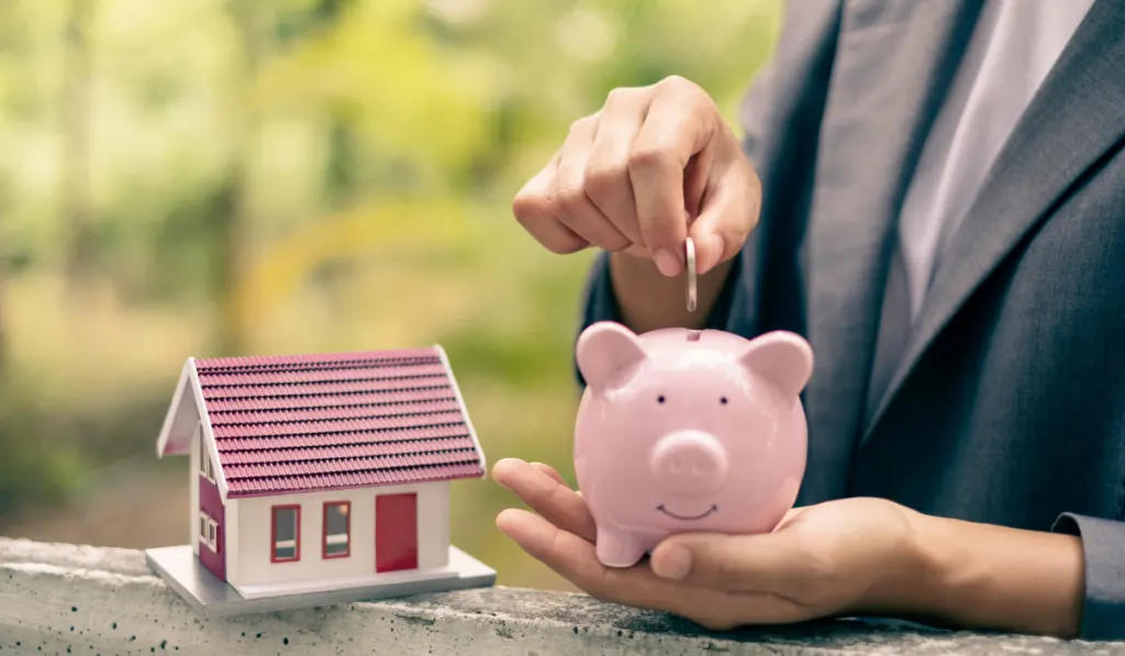 woman hold piggy banks and put coins in piggy banks to save money with coins