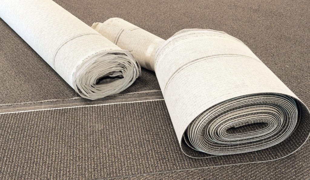 Carpet roll on the floor for carpet installation