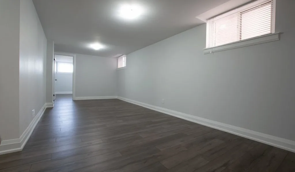 Wide shot of a finished empty basement