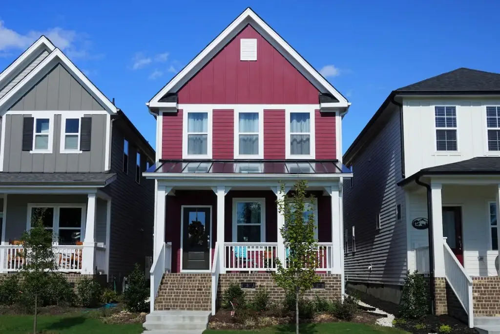 Two story, red, row house in a suburban neighborhood in North Carolina